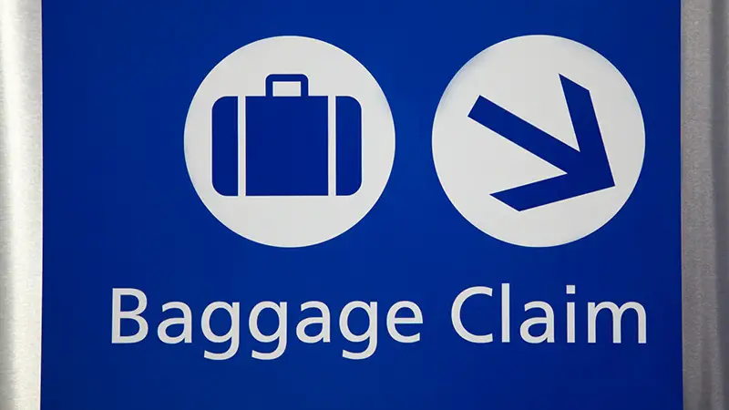 Baggage claim airport pickup sign